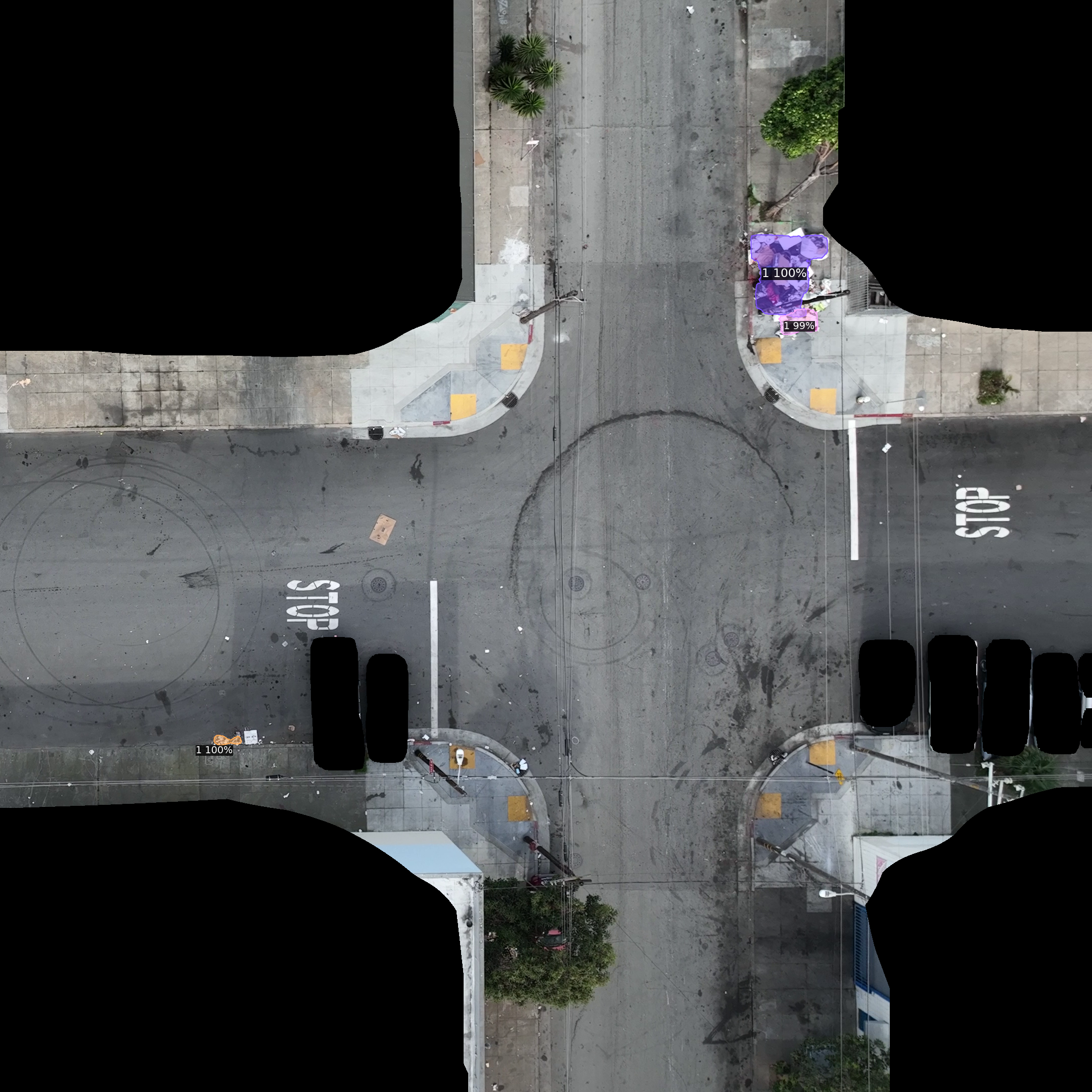 Aerial view of an intersection with purple-highlighted dumping on the sidewalk beside a corner curb ramp